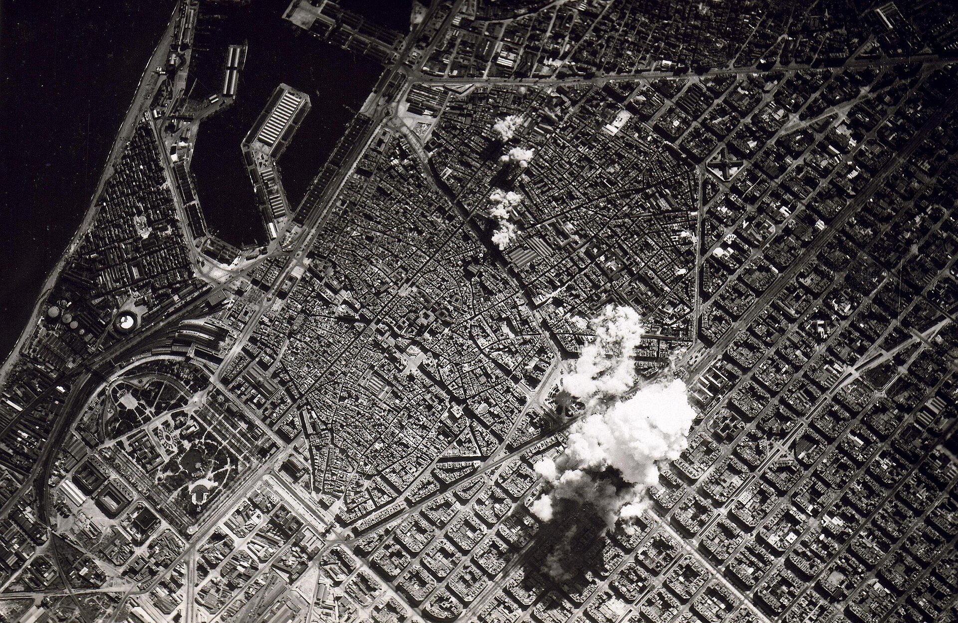 Smoke covers Barcelona’s residential blocks during bombing. The Republic and a military rebellion fought a civil war shaped by disputes over religion, property and political authority.